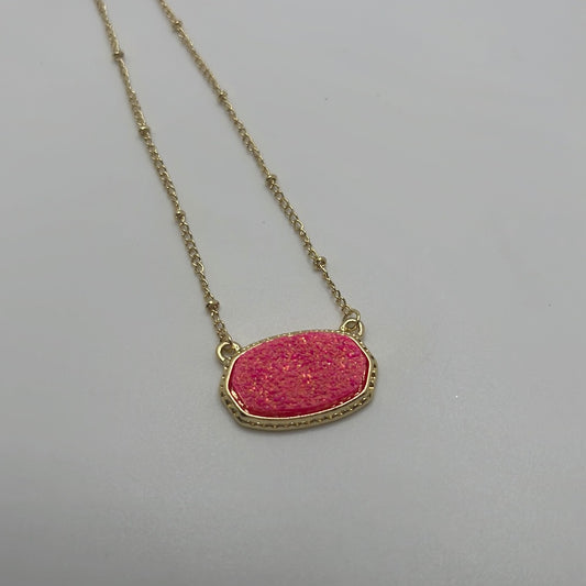 Gold chained necklace with pink pendant